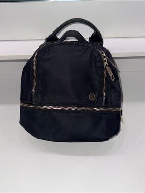 lululemon athletica Black Mini Backpack with Gold Zippers